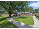 Charming house featuring a well-manicured lawn and landscaping, and beautiful exterior at 2009 Friendship Dr, Indianapolis, IN 46217