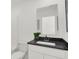Clean bathroom with a modern vanity, black countertop, and decorative grass at 2243 Hemlock Cir, Greenfield, IN 46140