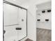 Modern bathroom features a glass-enclosed shower and view into closet at 2243 Hemlock Cir, Greenfield, IN 46140