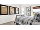 Charming bedroom with three decorative mirrors, neutral tones, and an abundance of natural light at 2243 Hemlock Cir, Greenfield, IN 46140