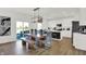 Bright dining area features bench seating, backyard access, and an adjacent modern kitchen at 2243 Hemlock Cir, Greenfield, IN 46140