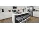Bright, modern kitchen with island seating, stainless steel appliances, and white cabinetry at 2243 Hemlock Cir, Greenfield, IN 46140