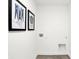 Clean, minimalist laundry room with modern utility hookups and stylish, laundry-themed art prints at 2243 Hemlock Cir, Greenfield, IN 46140
