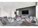Comfortable living room with modern gray sofas and a decorative entertainment center at 2243 Hemlock Cir, Greenfield, IN 46140