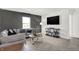 Stylish living room featuring a large sectional sofa, TV and modern decor at 2243 Hemlock Cir, Greenfield, IN 46140