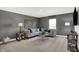 Comfortable living room featuring a large sectional sofa and neutral tones at 2243 Hemlock Cir, Greenfield, IN 46140