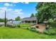 Large backyard features well-kept lawn and fence at 313 E South St, Morristown, IN 46161