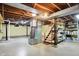 Unfinished basement with exposed wood beams and concrete floor ready for customization at 313 E South St, Morristown, IN 46161