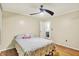 Spacious bedroom with hardwood floors, ceiling fan and ensuite bathroom access at 313 E South St, Morristown, IN 46161