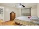 Cozy bedroom features hardwood floors, closet and a vintage wood dresser at 313 E South St, Morristown, IN 46161