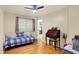 Bedroom featuring hardwood floors and modern ceiling fan at 313 E South St, Morristown, IN 46161