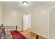 Simple bedroom with hardwood floors and ensuite bathroom access at 313 E South St, Morristown, IN 46161