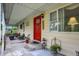 Inviting front porch with decorative plants and comfortable seating area at 313 E South St, Morristown, IN 46161