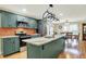 Modern kitchen with a large island and seating featuring stainless steel appliances at 313 E South St, Morristown, IN 46161