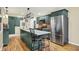 Well-appointed kitchen featuring an island with seating and stainless steel refrigerator at 313 E South St, Morristown, IN 46161