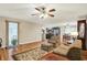 Cozy living room with hardwood floors leading to an open kitchen and dining area at 313 E South St, Morristown, IN 46161