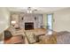 Spacious living area offers a brick fireplace, hardwood floors, and a cozy atmosphere at 313 E South St, Morristown, IN 46161