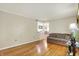 Inviting living room with hardwood flooring offering views to the dining area at 313 E South St, Morristown, IN 46161