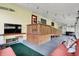 Enclosed porch with cushioned seating and wood accents at 313 E South St, Morristown, IN 46161