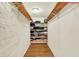 Walk-in closet with custom wood and wire shelving for optimal organization at 313 E South St, Morristown, IN 46161