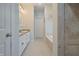 This bathroom has dual sinks, granite counters, white cabinets, and a separate bathtub at 3247 Moonlight Ct, Columbus, IN 47203