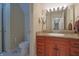 Bathroom features include granite counters, custom vanity, and a large mirror with vanity lighting at 3247 Moonlight Ct, Columbus, IN 47203