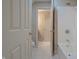 Bright bathroom featuring white tile floors, white bath tub, and white fixtures at 3247 Moonlight Ct, Columbus, IN 47203