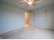 Spacious empty bedroom featuring a ceiling fan and carpet flooring at 3247 Moonlight Ct, Columbus, IN 47203
