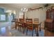 Elegant dining room features a chandelier, hardwood floors, and a built-in china cabinet at 3247 Moonlight Ct, Columbus, IN 47203