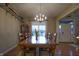 Cozy dining room with wooden floors and a plant on the table for a natural touch at 3247 Moonlight Ct, Columbus, IN 47203