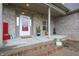 Charming front porch with a brick facade, decorative plants, and stylish accents creating a welcoming entrance at 3247 Moonlight Ct, Columbus, IN 47203