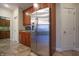 Modern kitchen with stainless steel refrigerator and wood cabinets at 3247 Moonlight Ct, Columbus, IN 47203