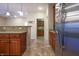 Modern kitchen with stainless steel refrigerator and wood cabinets at 3247 Moonlight Ct, Columbus, IN 47203