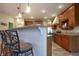 Beautiful kitchen with stainless steel appliances, granite countertops, and a breakfast bar with stylish chairs at 3247 Moonlight Ct, Columbus, IN 47203
