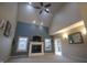 Bright living room featuring a fireplace, ceiling fan, and vaulted ceilings for a grand feel at 3247 Moonlight Ct, Columbus, IN 47203