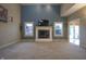 Spacious living room with a fireplace, tall ceilings, and large windows for natural light at 3247 Moonlight Ct, Columbus, IN 47203