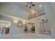 Spacious living room with hardwood floors, a balcony, and an open view to the kitchen at 3247 Moonlight Ct, Columbus, IN 47203