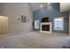 Cozy living room with a fireplace, carpeted floors, and tasteful decor for a comfortable atmosphere at 3247 Moonlight Ct, Columbus, IN 47203