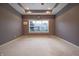 The main bedroom has neutral carpet and a large window for ample natural light at 3247 Moonlight Ct, Columbus, IN 47203