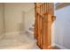 Close-up of a wood railing on a carpeted staircase at 3247 Moonlight Ct, Columbus, IN 47203