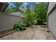 A serene backyard featuring a stone walkway, rock garden, and a privacy fence at 35 Osage Ct, Columbus, IN 47201