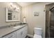 Tastefully decorated bathroom with gray countertop, modern faucet, and decorative wall art at 35 Osage Ct, Columbus, IN 47201