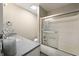 Clean bathroom featuring a shower, and vanity with white cabinetry and stone countertop at 35 Osage Ct, Columbus, IN 47201