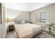Cozy bedroom with a queen-size bed, stylish rug, and natural light from the window at 35 Osage Ct, Columbus, IN 47201