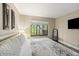 Well-lit bedroom with a comfortable bed, view to nature, and modern decor at 35 Osage Ct, Columbus, IN 47201