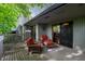 Inviting outdoor deck with comfortable seating and a view of trees at 35 Osage Ct, Columbus, IN 47201