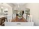 Spacious dining room featuring a large wood table with seating for ten guests and lots of natural light at 35 Osage Ct, Columbus, IN 47201
