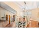 Open dining room showcasing a contemporary chandelier and a view of the staircase leading to the upper level at 35 Osage Ct, Columbus, IN 47201