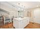 Open floorplan kitchen featuring a large island with granite countertops, perfect for entertaining guests at 35 Osage Ct, Columbus, IN 47201
