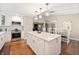 Open floorplan kitchen featuring a large island with granite countertops and stainless steel appliances at 35 Osage Ct, Columbus, IN 47201